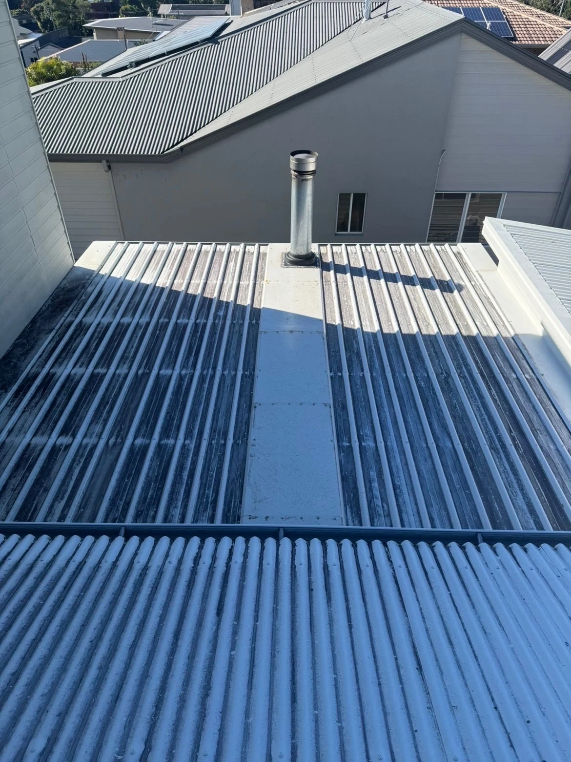 Metal roof with built-up grime